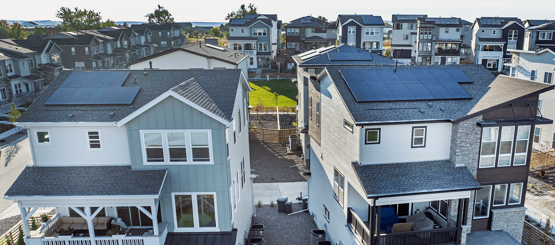 Two homes with solar panels on their roofs, from Lafayette, CO
