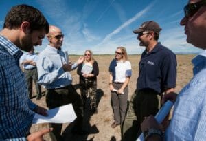 From left to right: James Jensen, Tom Johnson, Jody Rosier, and Rebecca Kauffman of Southern Ute Alternative Energy, and Otto VanGeet and Alex Dane of NREL, tour a potential solar array site on Southern Ute tribal land in Ignacio, CO. Photo by Dennis Schroeder, NREL