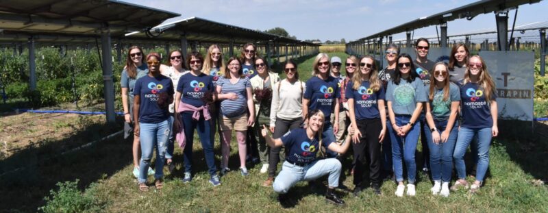 large group wearing namaste solar branded shirts