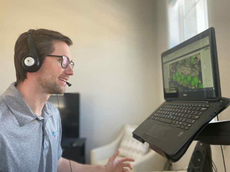 employee in headset working on computer