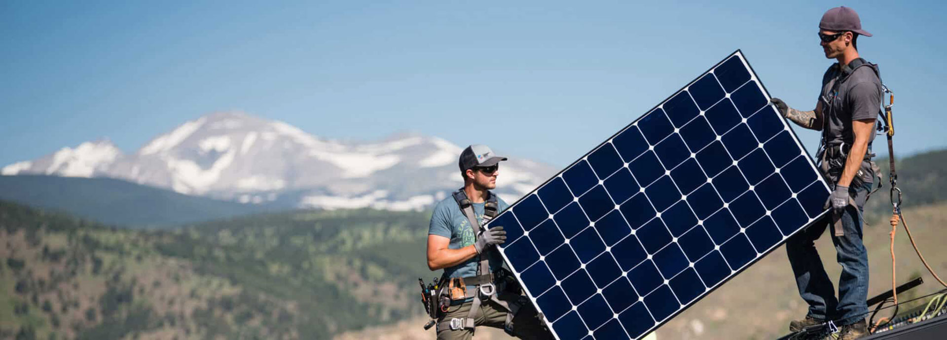 installing solar, mountain background